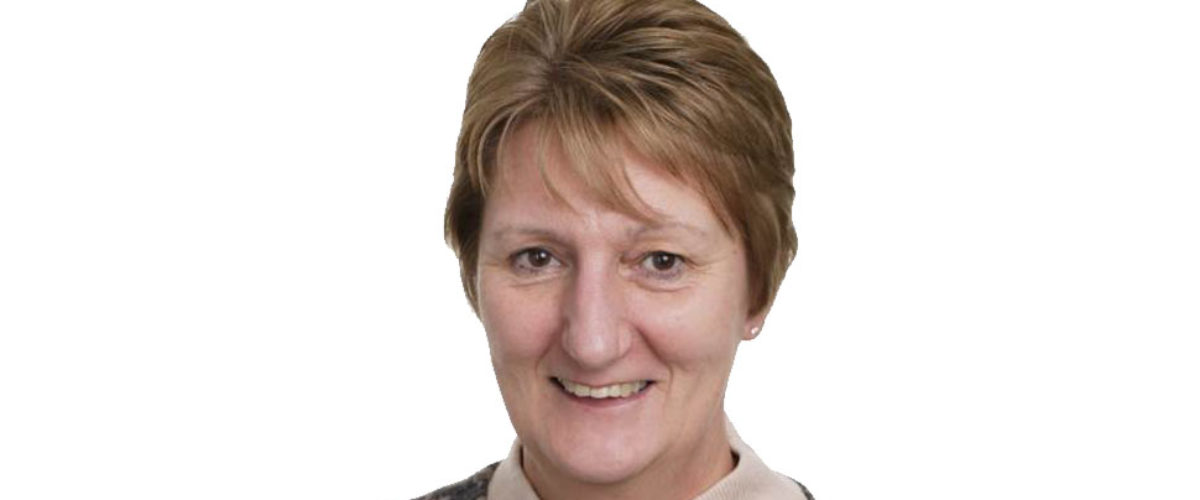 Headshot of Funding and Admissions Manager Linda Crump smiling at the camera