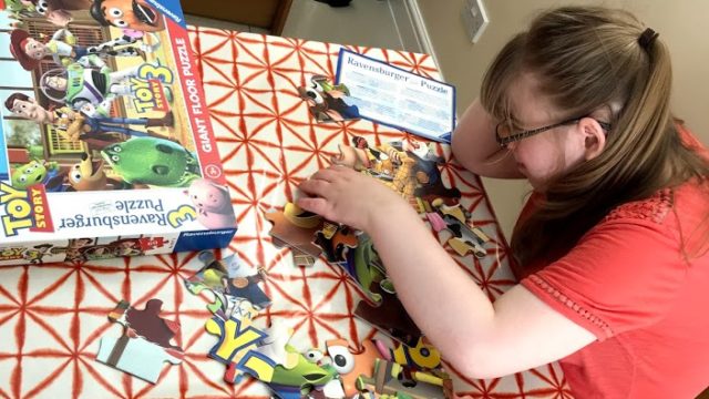Day Service member completing a jigsaw