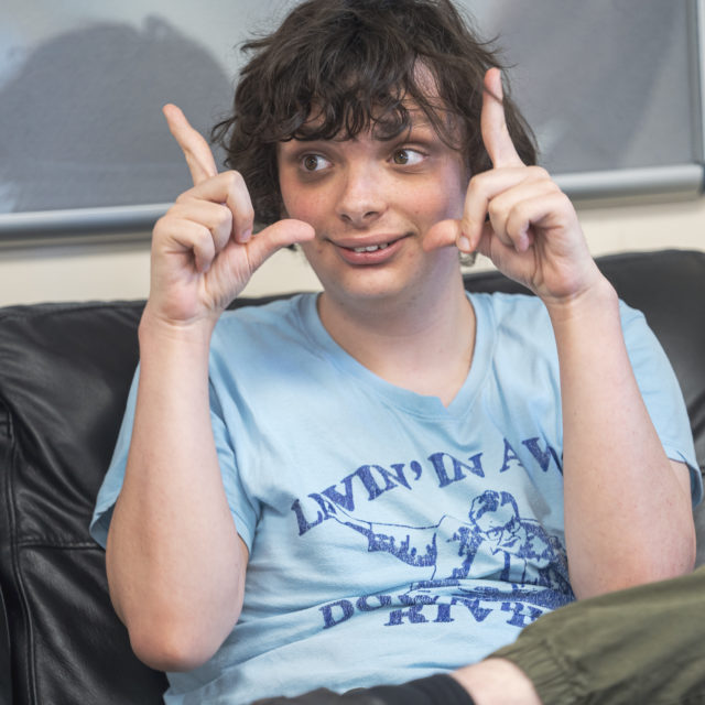 Student performing Makaton sign in performing arts session