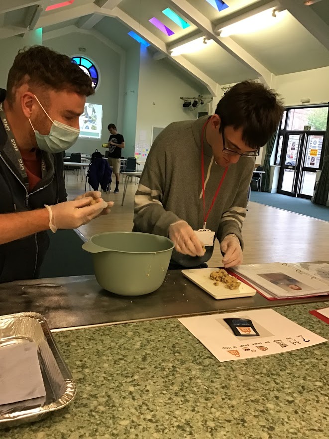 Student using resources to weigh the perfect cookie