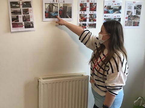 Student pointing at resources of themselves working